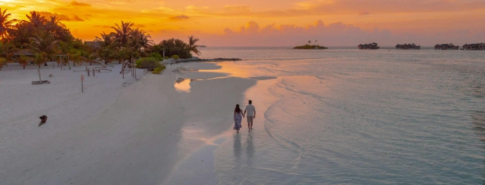 Praveg atoll's Thinnakara resort happy guest with Touristhub Holidays